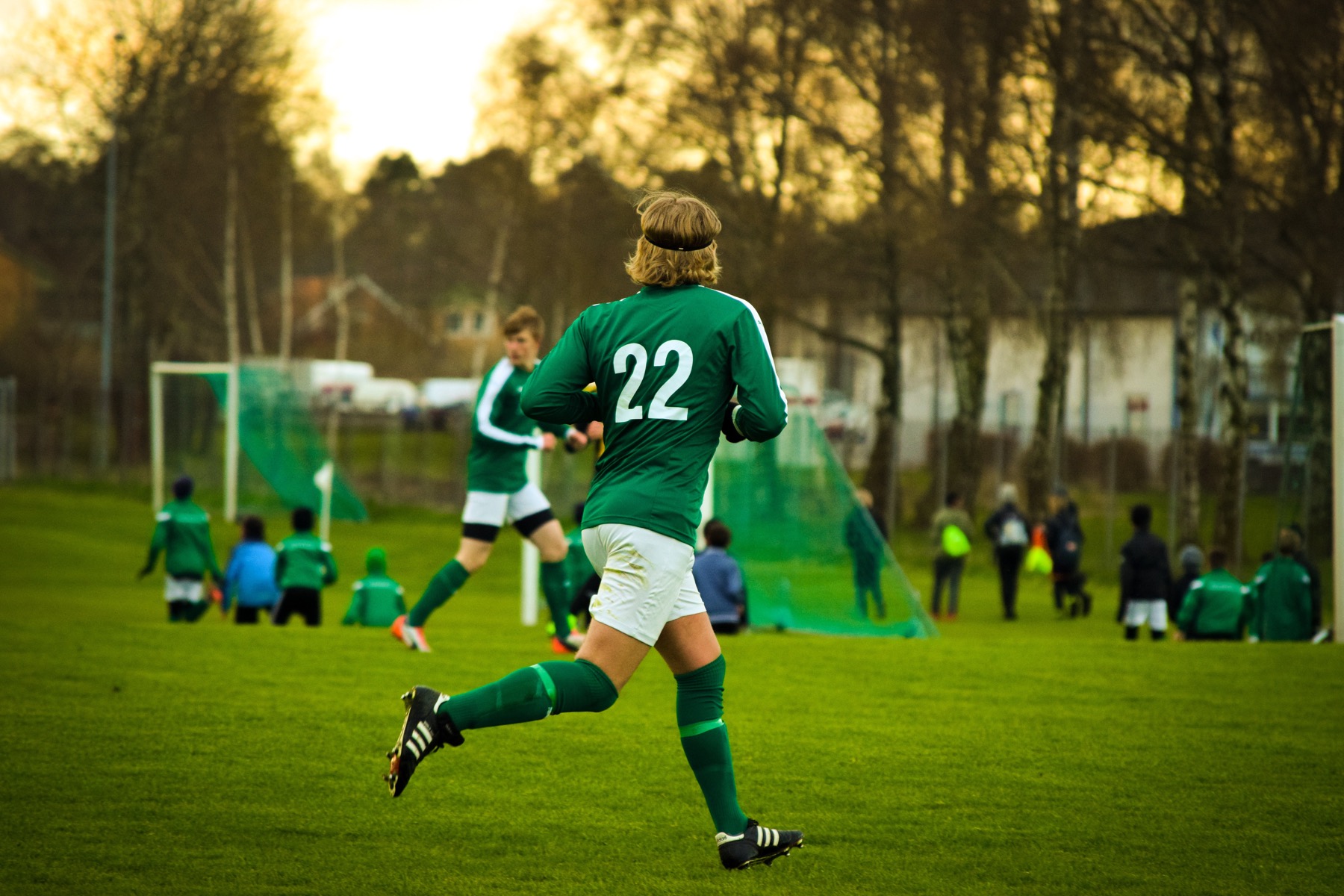 Football players in action on a pitch